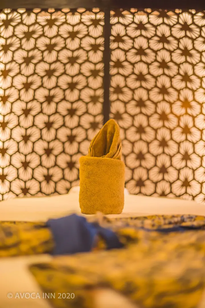 A neatly folded towel graces an Avoca Inn hotel room, showcasing attention to detail.
